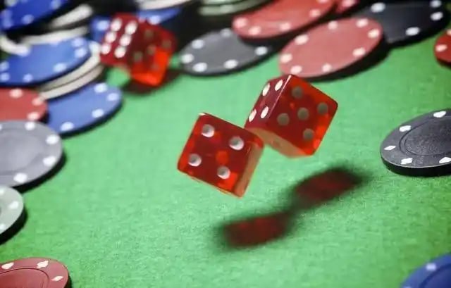 live roulette table with dealer and ball in motion